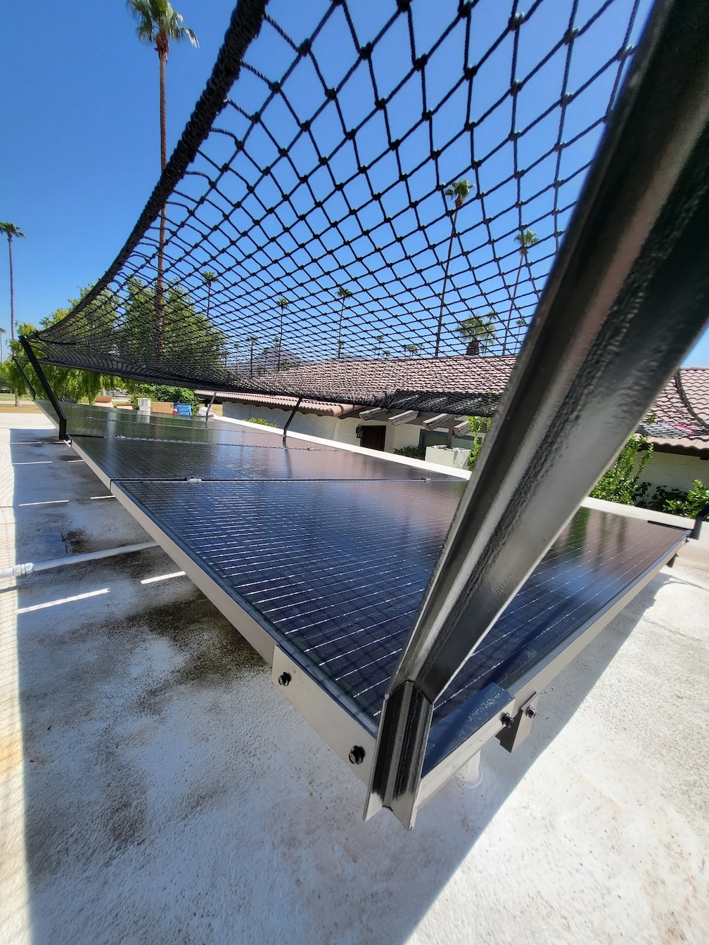 Net brackets attach directly to solar panel frames
