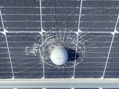 Golf ball in broken panel 1a
