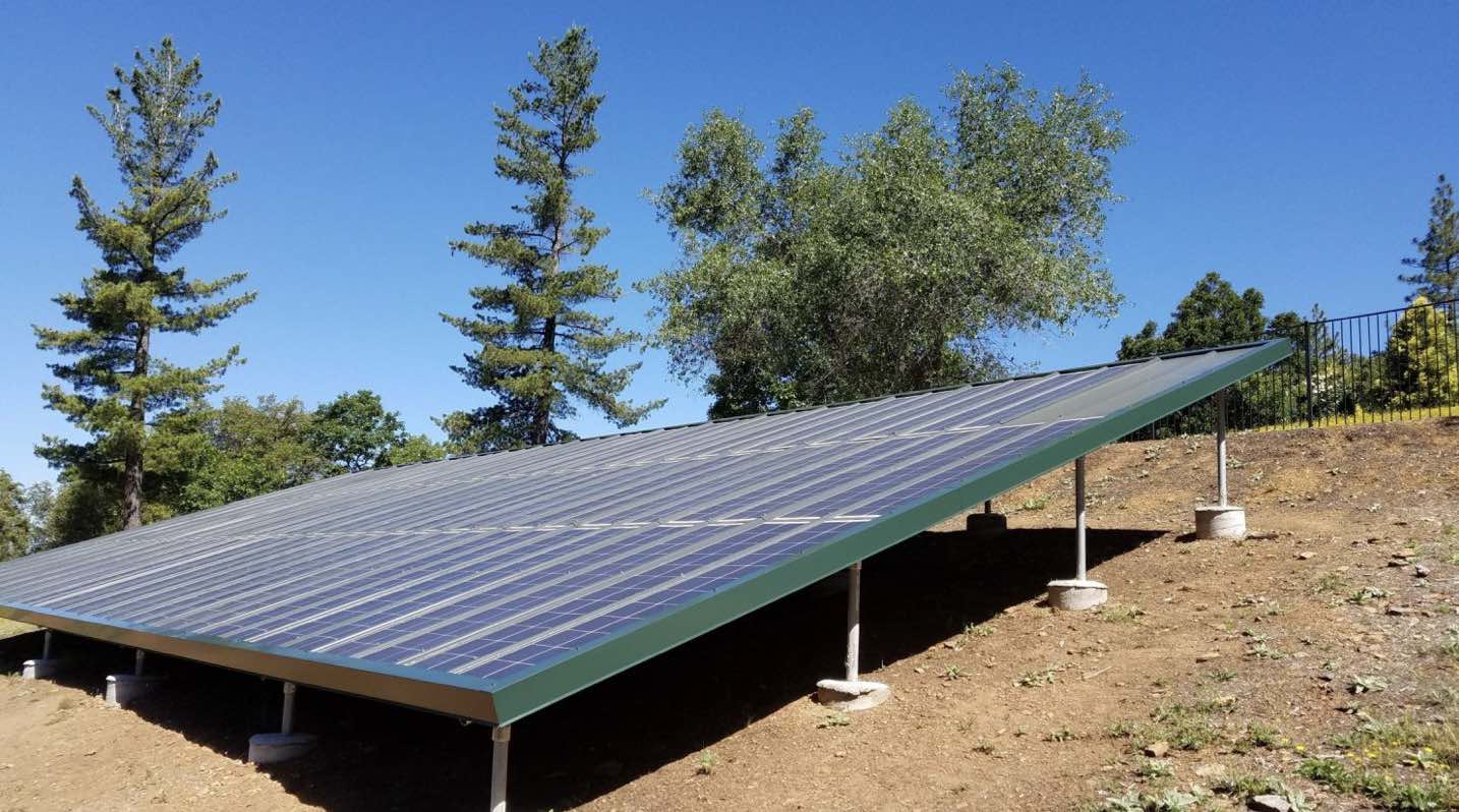 Ground mount solar array using steel roof solar panels
